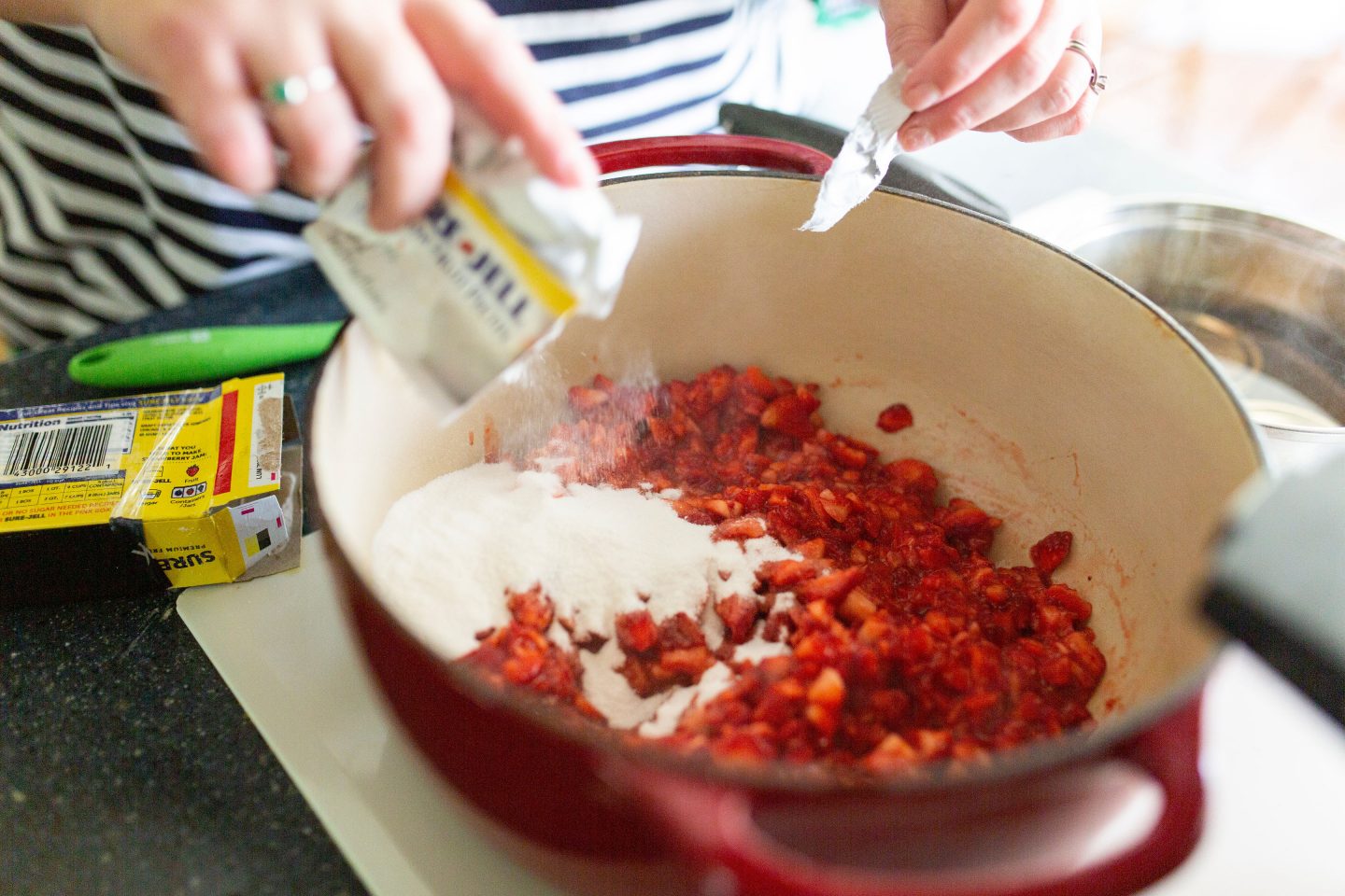 Want your to enjoy your fresh strawberries year round? Follow these easy steps on making your own homemade strawberry jam! #strawberryjam #canning #canningrecipe #surejell #jam