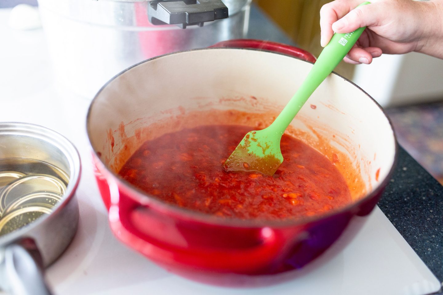 Want your to enjoy your fresh strawberries year round? Follow these easy steps on making your own homemade strawberry jam! #strawberryjam #canning #canningrecipe #surejell #jam