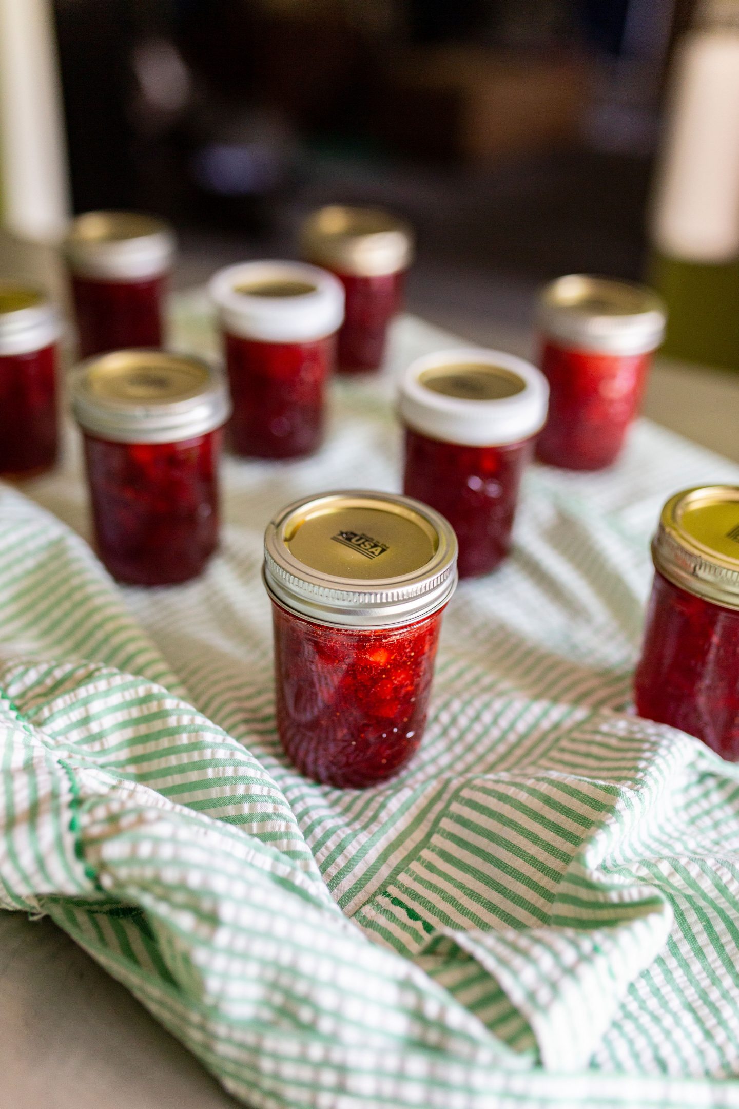 Want your to enjoy your fresh strawberries year round? Follow these easy steps on making your own homemade strawberry jam! #strawberryjam #canning #canningrecipe #surejell #jam