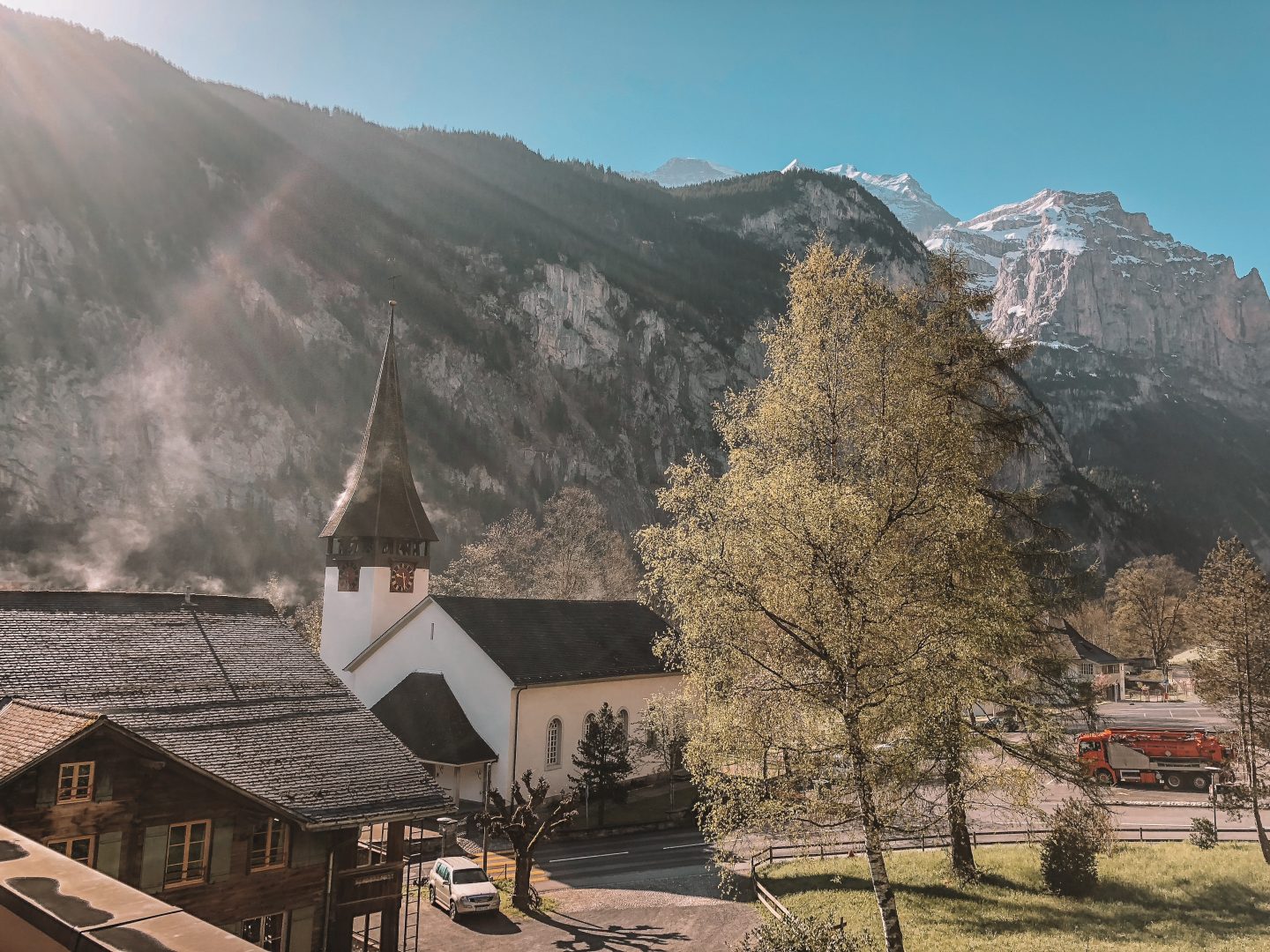 Watching the morning mist and sun rays in the valley of Lauterbrunnen, Switzerland. 