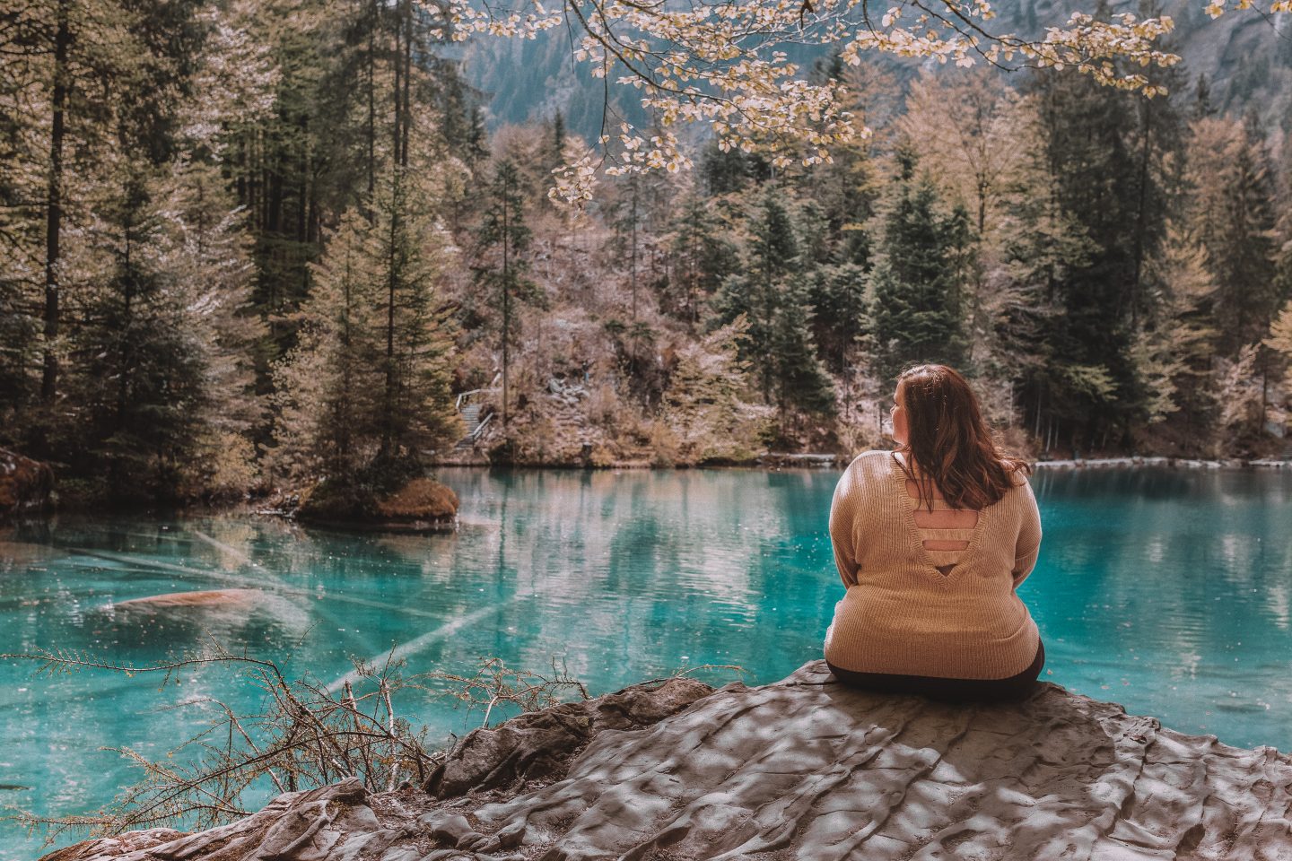 Sitting and basking in the crystal clear waters of Lake Blausee, Switzerland