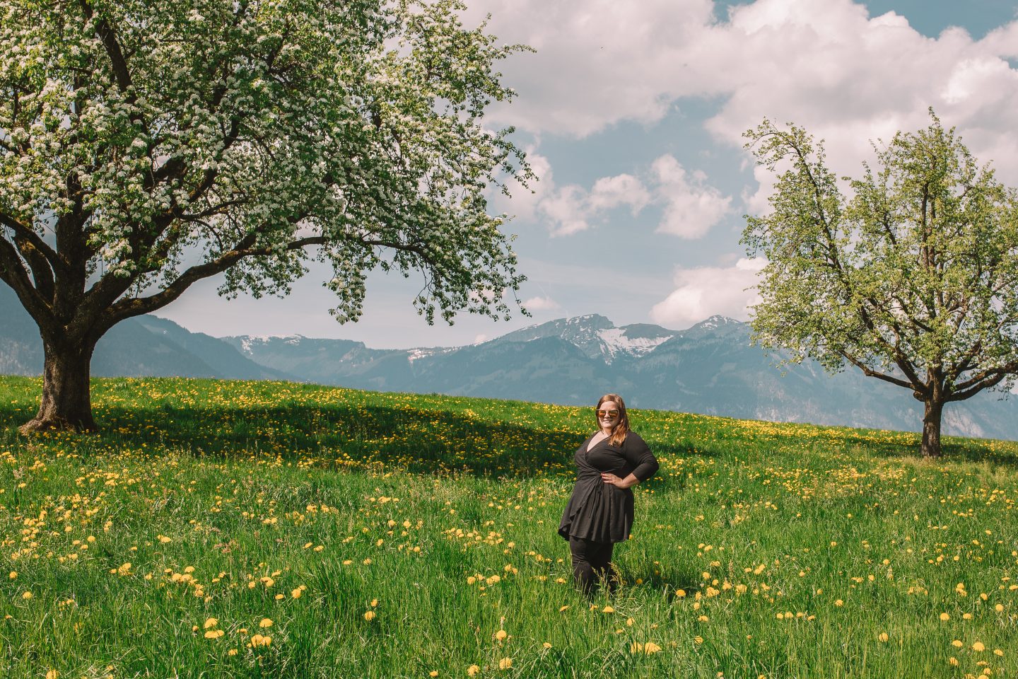 Standing in a field of wildflowers in the Swiss Alps.