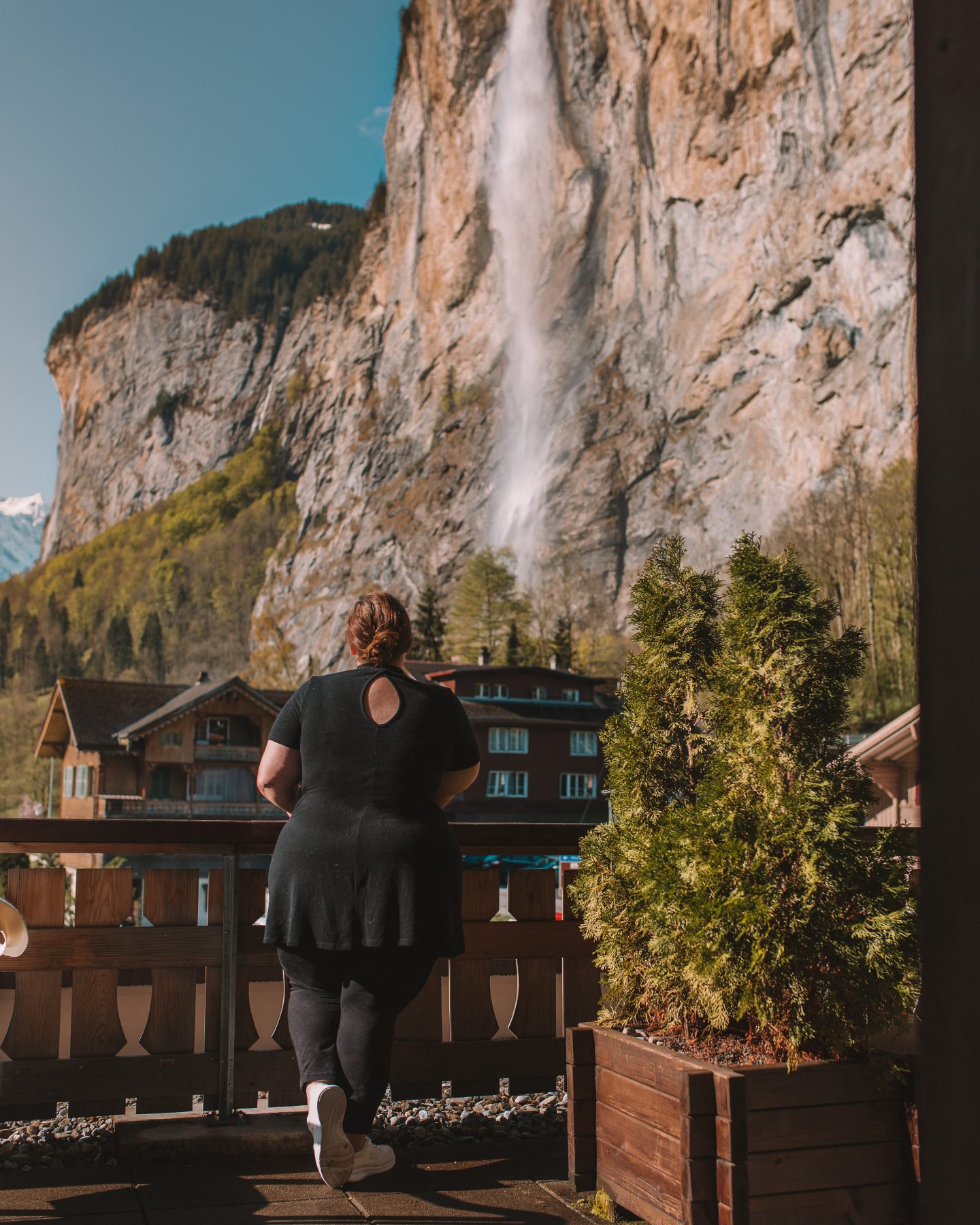Standing on the balance of Hotel Staubbach admired the Staubbach Falls in Lauterbrunnen, Switzerland.